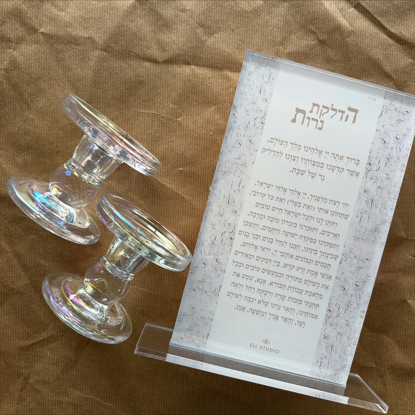 Detail of Shabbat Spark blessing set showing hand-painted textures and Hebrew Shabbat prayers