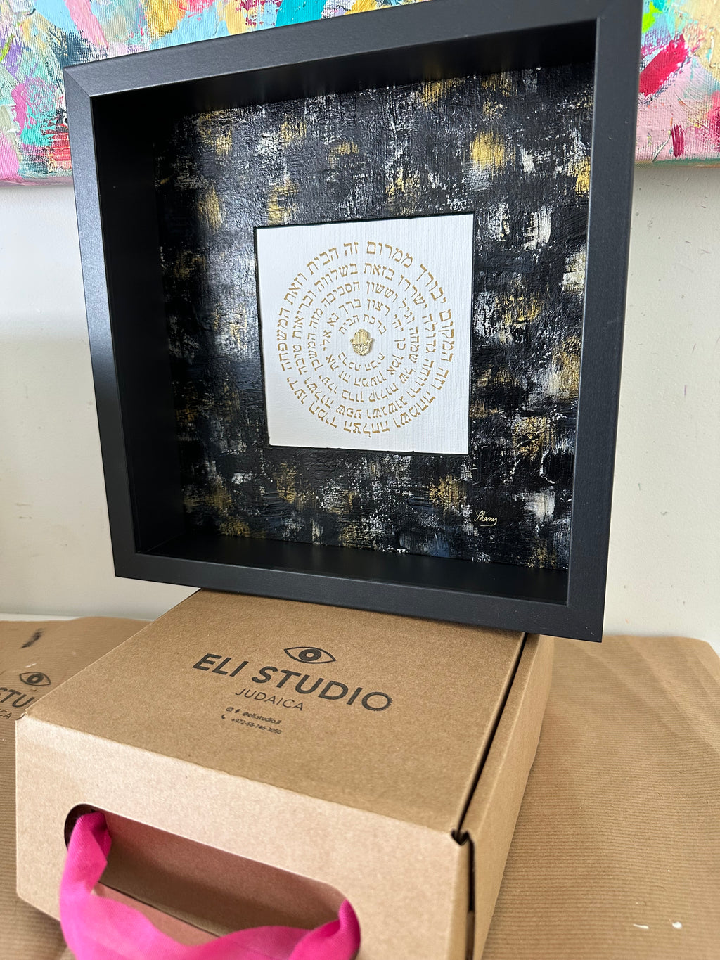 Angled view of Birkat HaBayit — Black & Gold, home blessing artwork showing layered textures and Hebrew calligraphy by Eli Studio