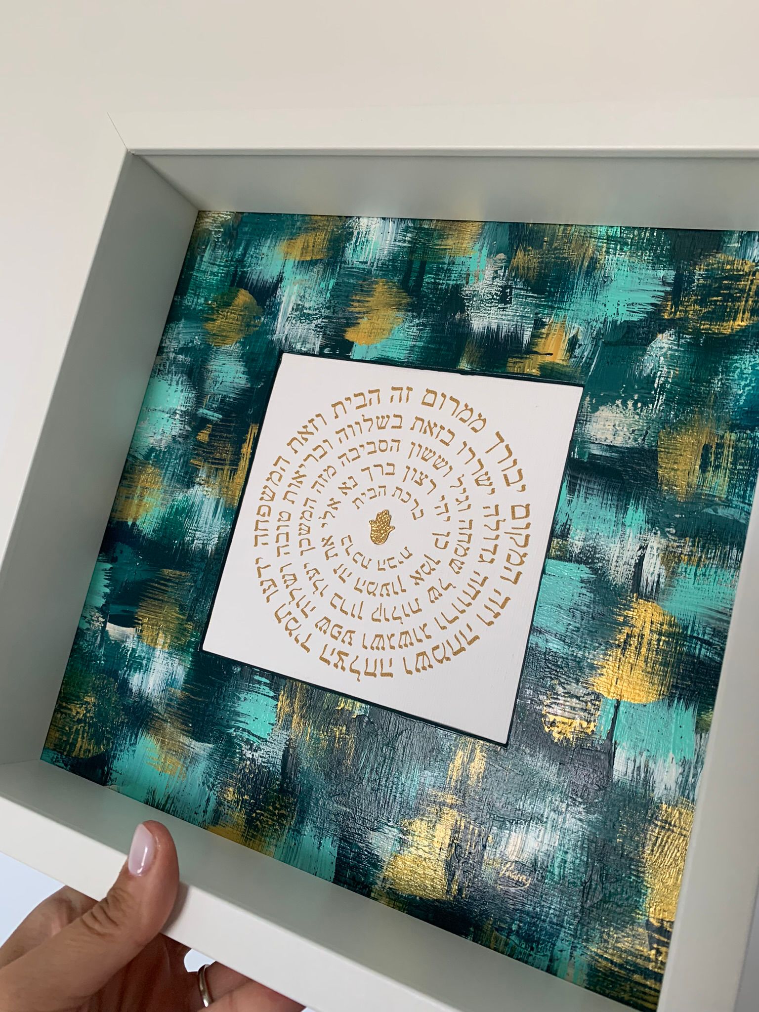 Birkat HaBayit shades of green artwork held in hand, framed home blessing with emerald and gold tones, Jewish housewarming gift