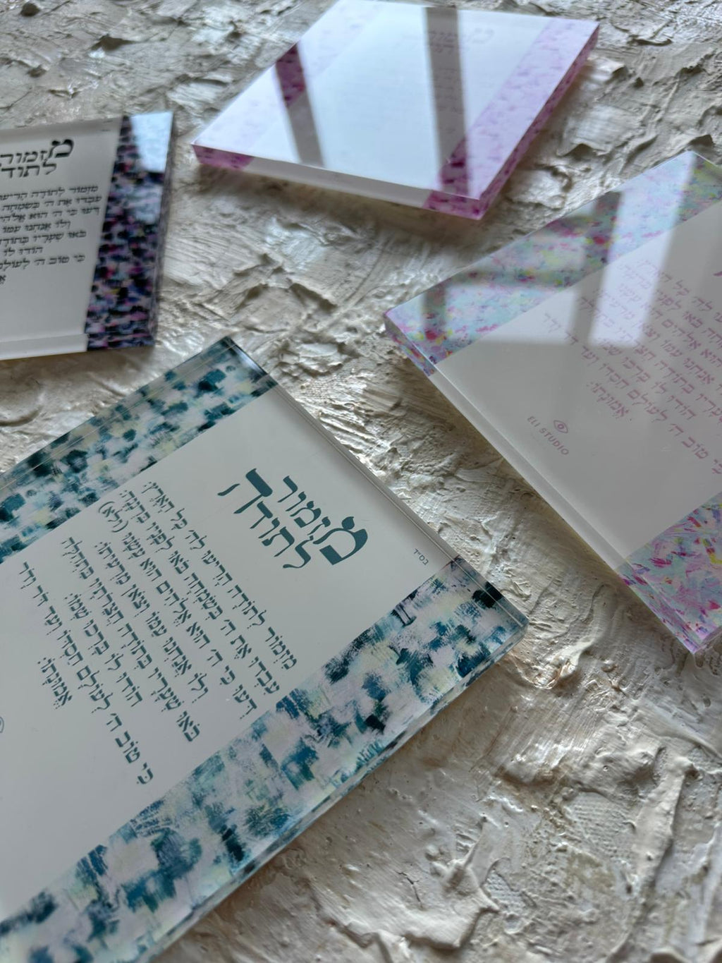 Close-up detail of Mizmor LeToda — The Plexi Compact showing hand-painted brushstrokes and Hebrew psalm of gratitude text